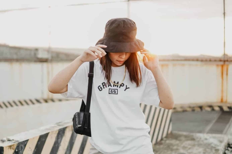 woman-in-white-shirt-wearing-brown-hat-3608533